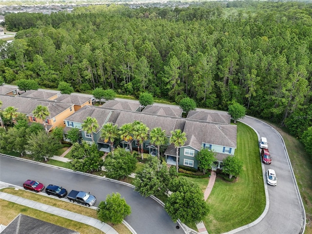 bird's eye view with a residential view and a wooded view