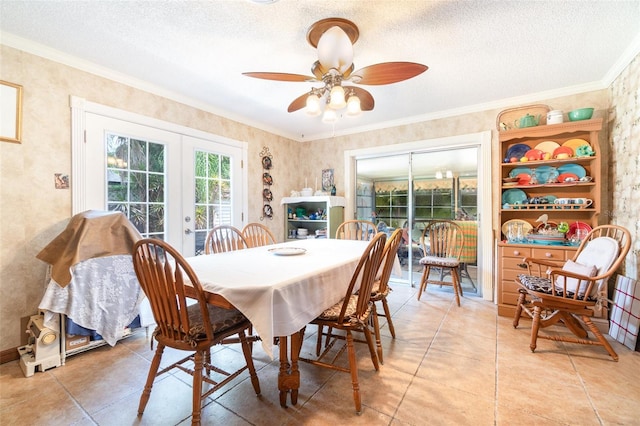 dining room featuring light tile patterned floors, ceiling fan, french doors, and a textured ceiling