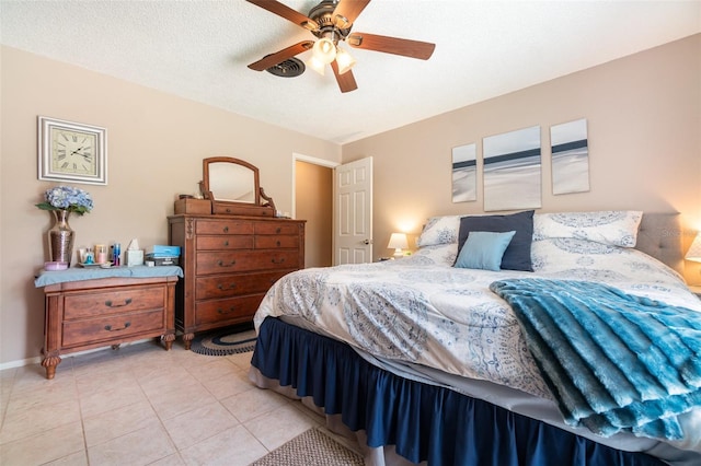 bedroom featuring light tile patterned flooring, baseboards, visible vents, and ceiling fan
