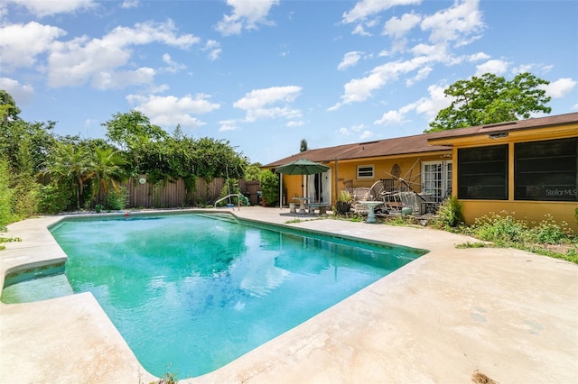 view of pool with a patio, fence, and a fenced in pool