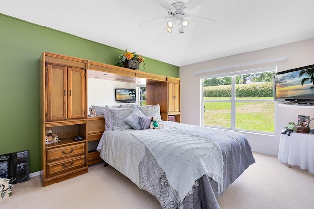 3661 Kingswood Ct, Clermont, FL 34711 - bedroom with baseboards, ceiling fan, and light colored carpet