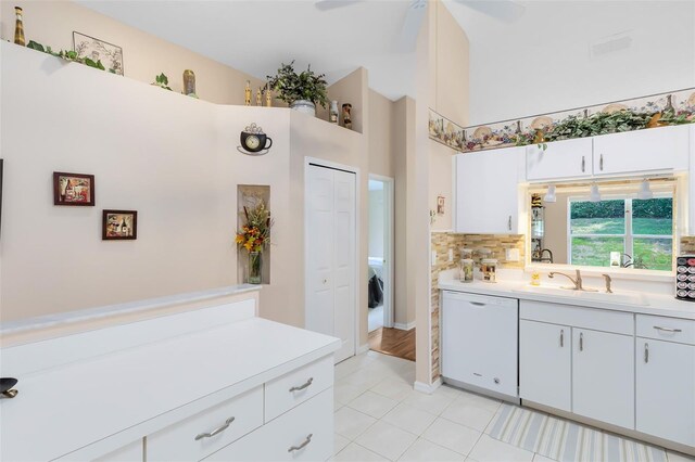 3661 Kingswood Ct, Clermont, FL 34711 - bathroom featuring decorative backsplash, ceiling fan, vanity, tile patterned floors, and a high ceiling