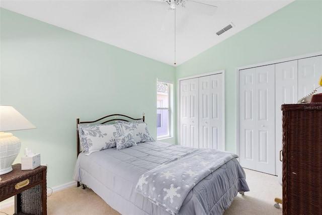 3661 Kingswood Ct, Clermont, FL 34711 - bedroom featuring a ceiling fan, visible vents, light colored carpet, two closets, and lofted ceiling