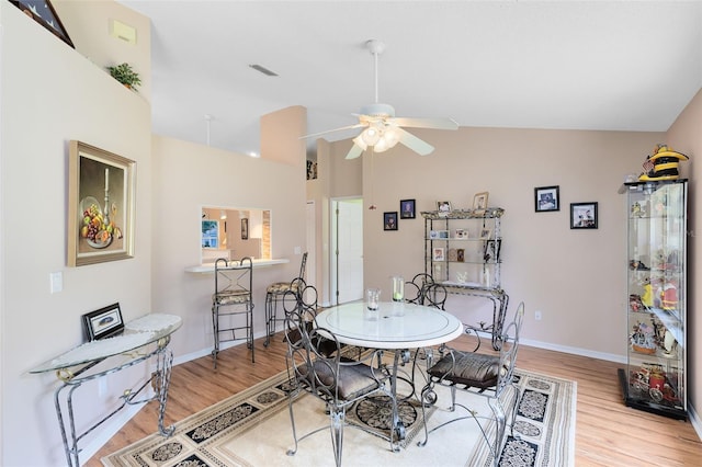 3661 Kingswood Ct, Clermont, FL 34711 - dining area with visible vents, a ceiling fan, baseboards, wood finished floors, and vaulted ceiling