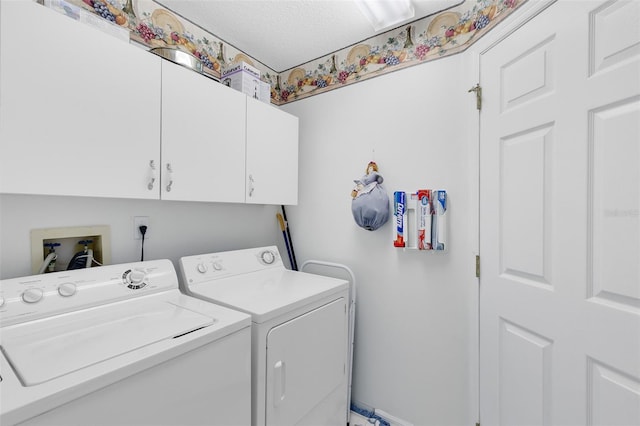 3661 Kingswood Ct, Clermont, FL 34711 - clothes washing area with baseboards, a textured ceiling, cabinet space, and washing machine and clothes dryer