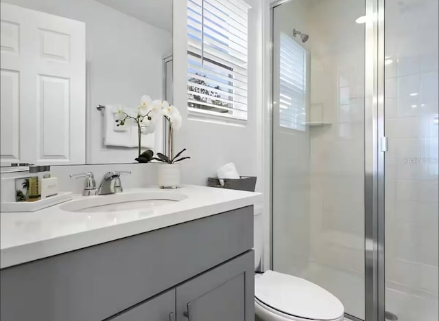 1929 Tropical Palms Cir, Kissimmee, FL 34747 - full bath featuring vanity, toilet, and a stall shower