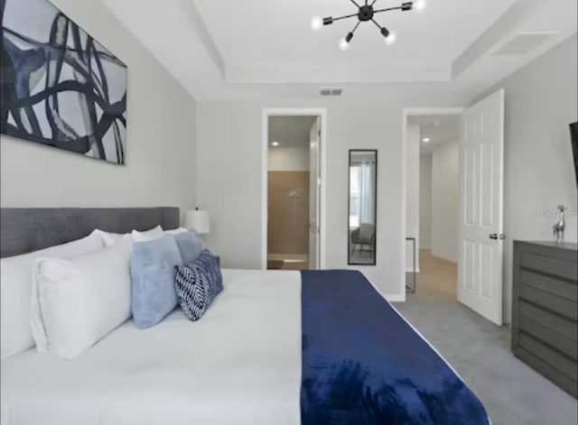 1929 Tropical Palms Cir, Kissimmee, FL 34747 - bedroom featuring a raised ceiling, visible vents, carpet floors, and a notable chandelier