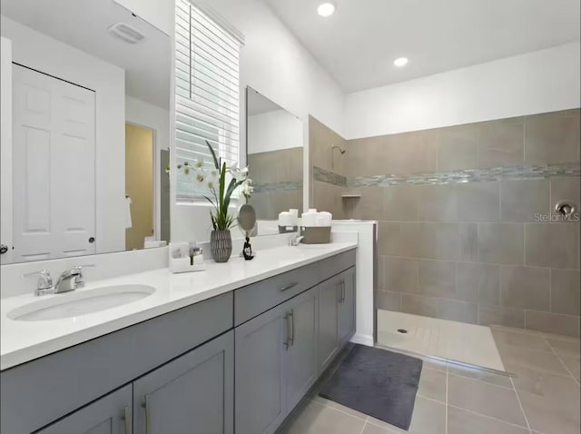 1929 Tropical Palms Cir, Kissimmee, FL 34747 - full bathroom featuring a sink, tile patterned flooring, walk in shower, and double vanity