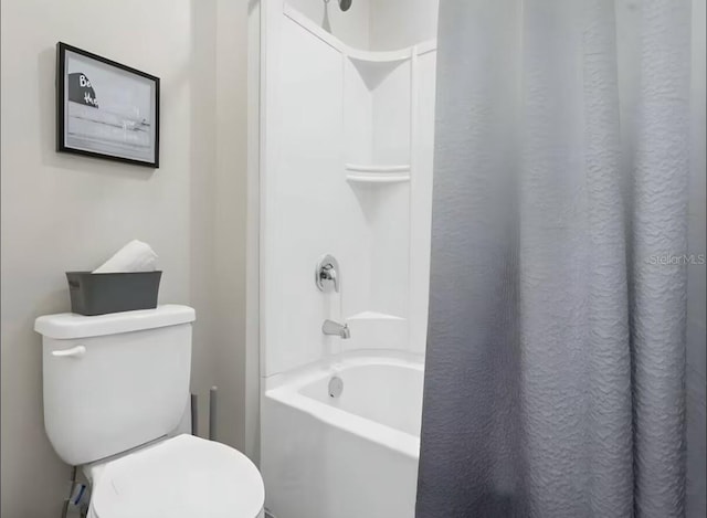 1929 Tropical Palms Cir, Kissimmee, FL 34747 - bathroom featuring shower / tub combo and toilet