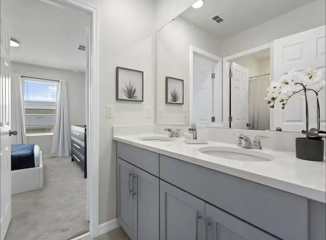 1929 Tropical Palms Cir, Kissimmee, FL 34747 - full bathroom featuring double vanity, visible vents, and a sink