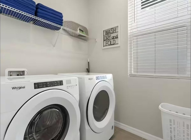 1929 Tropical Palms Cir, Kissimmee, FL 34747 - washroom featuring washer and dryer, laundry area, and baseboards