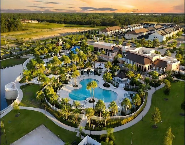 1929 Tropical Palms Cir, Kissimmee, FL 34747 - aerial view at dusk featuring a water view