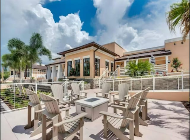 1929 Tropical Palms Cir, Kissimmee, FL 34747 - view of patio / terrace featuring a fire pit