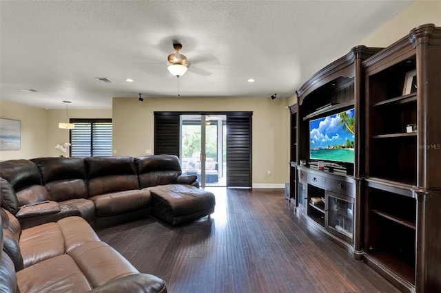 living room featuring a healthy amount of sunlight, baseboards, ceiling fan, recessed lighting, and dark wood finished floors