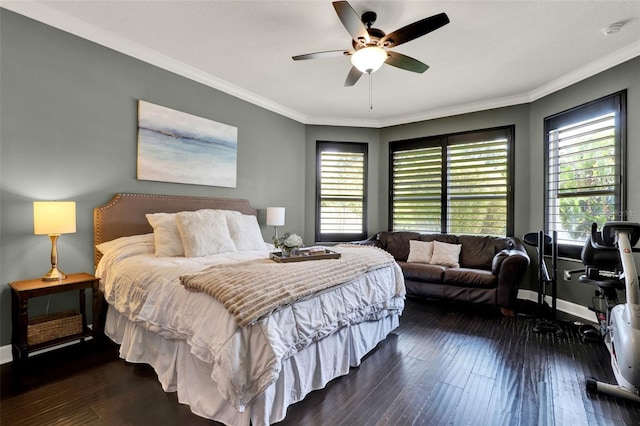 bedroom with crown molding, baseboards, dark wood-style floors, and multiple windows
