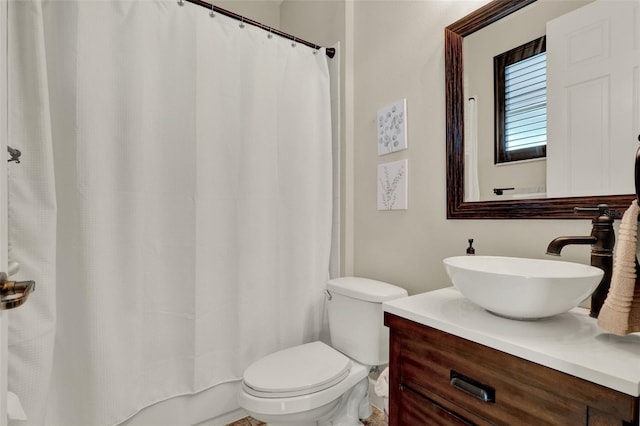 bathroom with toilet and vanity