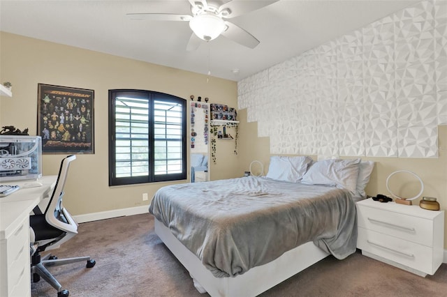 bedroom featuring a ceiling fan, baseboards, and dark carpet