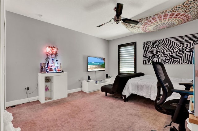 carpeted bedroom with baseboards and ceiling fan