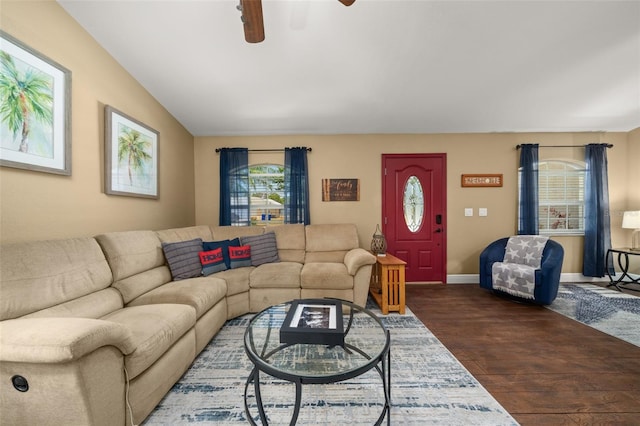 living room featuring dark wood-style flooring, a ceiling fan, baseboards, and lofted ceiling