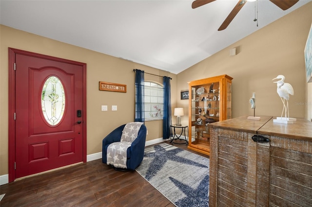 entryway with dark wood-type flooring, a ceiling fan, baseboards, and lofted ceiling