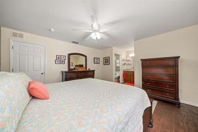 bedroom with baseboards, a ceiling fan, dark wood finished floors, and visible vents