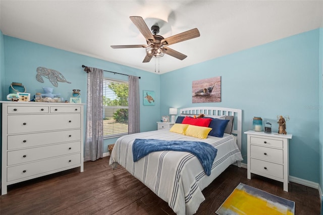 bedroom with baseboards, dark wood finished floors, and ceiling fan