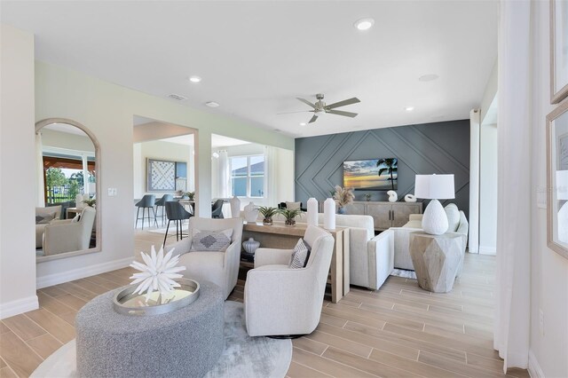 living room with a ceiling fan, baseboards, recessed lighting, wood tiled floor, and visible vents