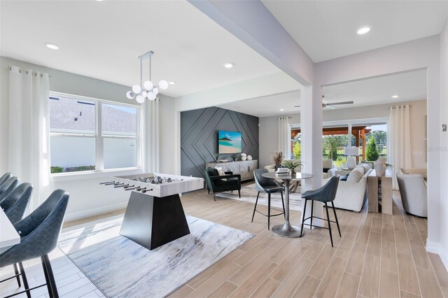 game room with recessed lighting, ceiling fan, and light wood-style floors