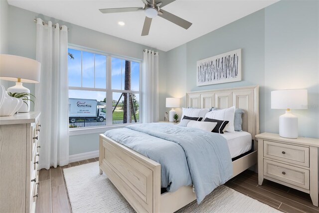 bedroom featuring recessed lighting, a ceiling fan, dark wood-style floors, and baseboards