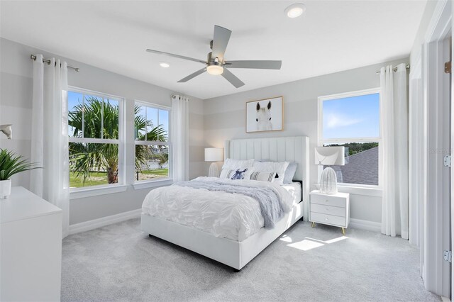 carpeted bedroom with baseboards, a ceiling fan, and recessed lighting