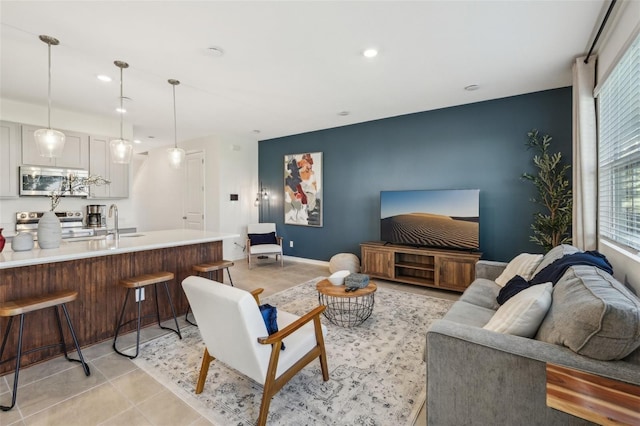 734 Longboat Dr, Davenport, FL 33896 - living area with recessed lighting, an accent wall, light tile patterned floors, and baseboards