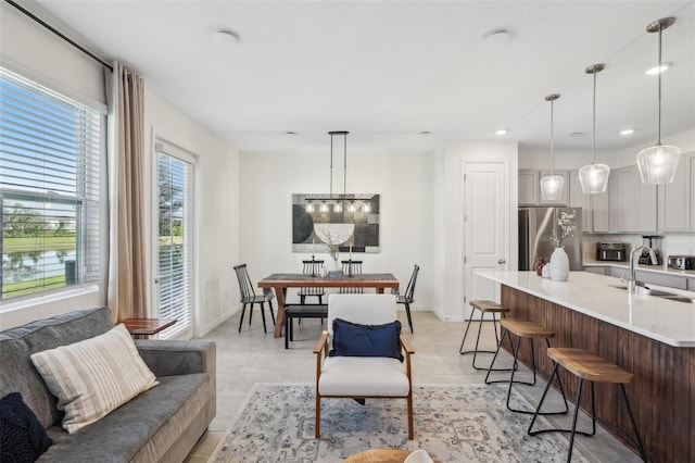 734 Longboat Dr, Davenport, FL 33896 - living room with baseboards, light tile patterned floors, and recessed lighting