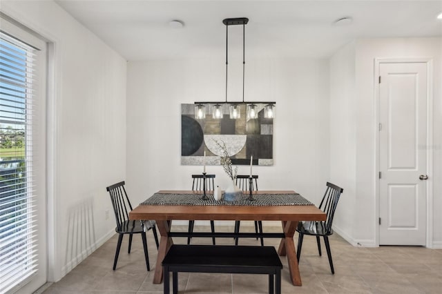 734 Longboat Dr, Davenport, FL 33896 - dining room featuring light tile patterned flooring and baseboards