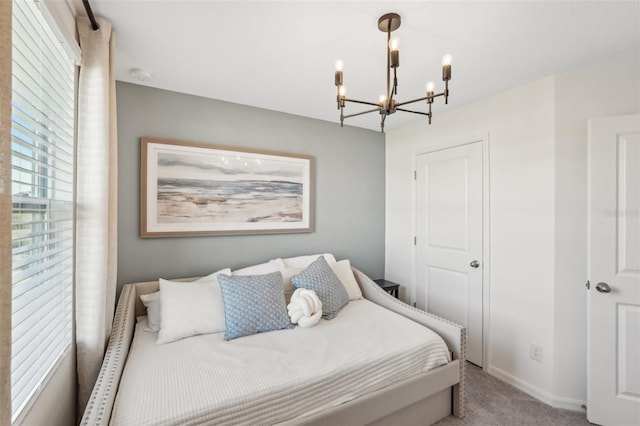 734 Longboat Dr, Davenport, FL 33896 - carpeted bedroom featuring a chandelier and baseboards