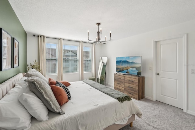 734 Longboat Dr, Davenport, FL 33896 - bedroom featuring a chandelier, carpet, a textured ceiling, and baseboards