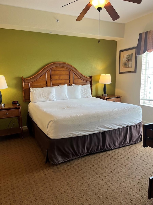carpeted bedroom with a ceiling fan