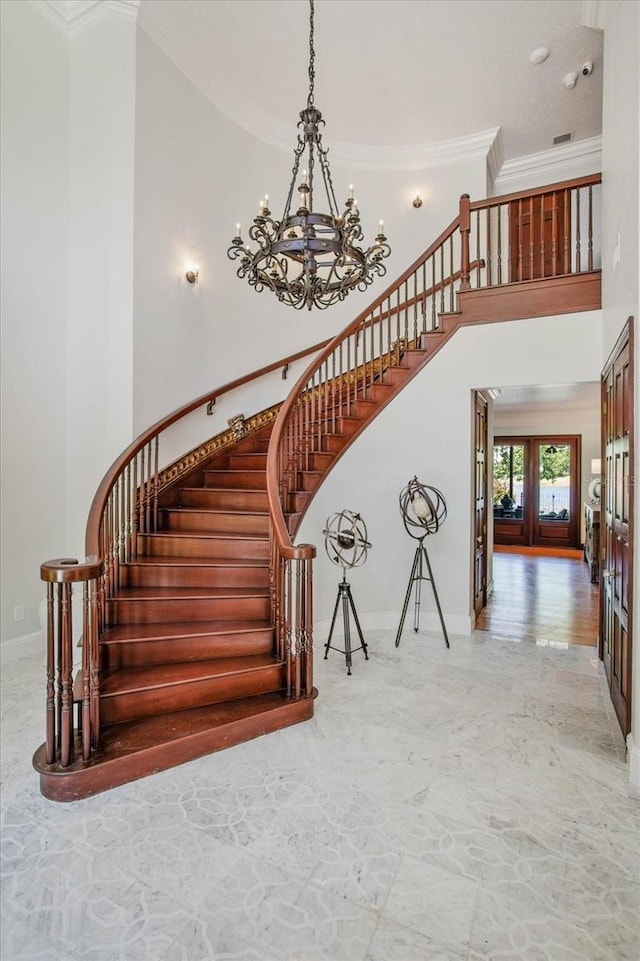 2828 Marquesas Ct, Windermere, FL 34786 - staircase with a chandelier, a towering ceiling, ornamental molding, baseboards, and french doors