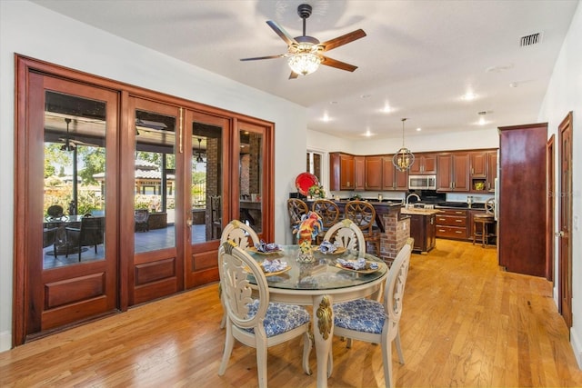 2828 Marquesas Ct, Windermere, FL 34786 - dining room featuring light wood-type flooring, french doors, and ceiling fan