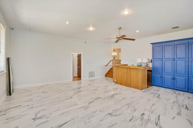 2828 Marquesas Ct, Windermere, FL 34786 - unfurnished living room featuring stairway, a ceiling fan, recessed lighting, a textured ceiling, and baseboards
