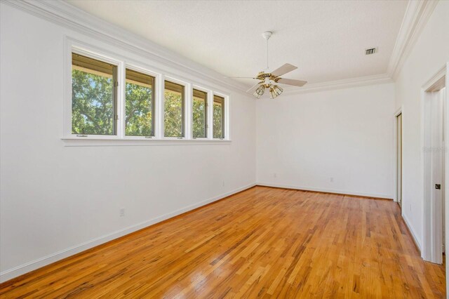 2828 Marquesas Ct, Windermere, FL 34786 - unfurnished room with crown molding, light wood finished floors, baseboards, and a ceiling fan