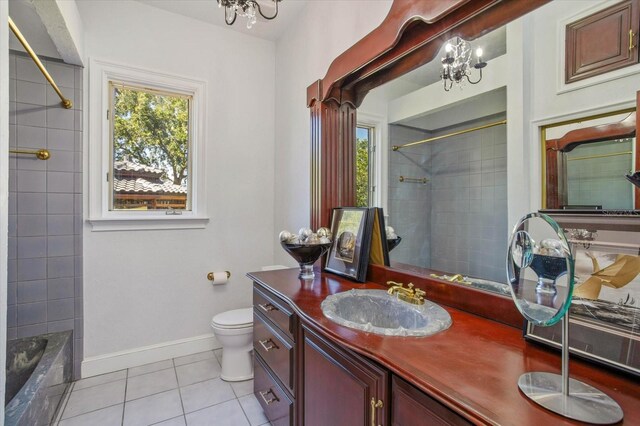 2828 Marquesas Ct, Windermere, FL 34786 - full bath featuring tile patterned floors, toilet, a chandelier, and baseboards