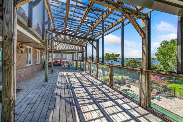 2828 Marquesas Ct, Windermere, FL 34786 - wooden deck with a pergola, a water view, and a pool with connected hot tub