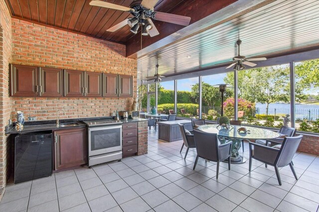 2828 Marquesas Ct, Windermere, FL 34786 - view of patio with ceiling fan, area for grilling, outdoor dining area, a sink, and fence