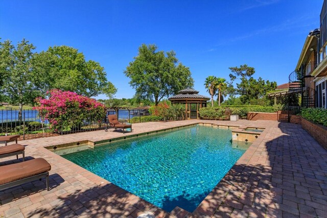 2828 Marquesas Ct, Windermere, FL 34786 - view of pool with a patio area, a gazebo, fence, and an in-ground hot tub