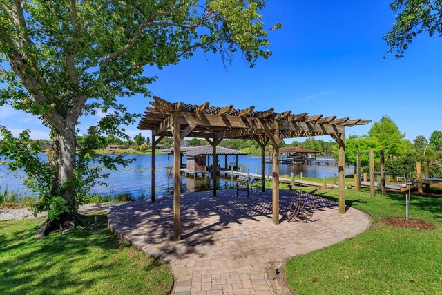 2828 Marquesas Ct, Windermere, FL 34786 - view of patio / terrace featuring boat lift, a dock, a water view, and a pergola