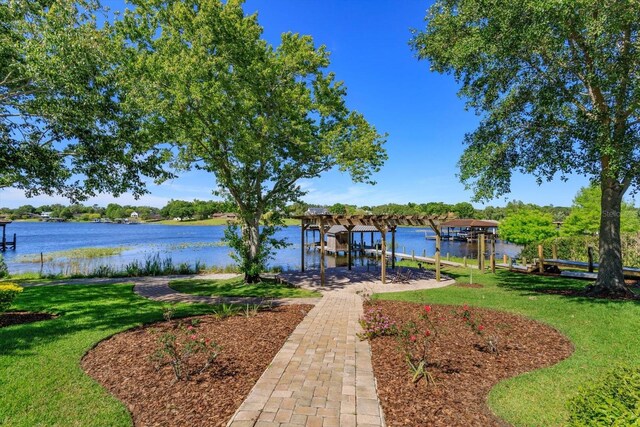 2828 Marquesas Ct, Windermere, FL 34786 - dock featuring a lawn, a water view, and boat lift