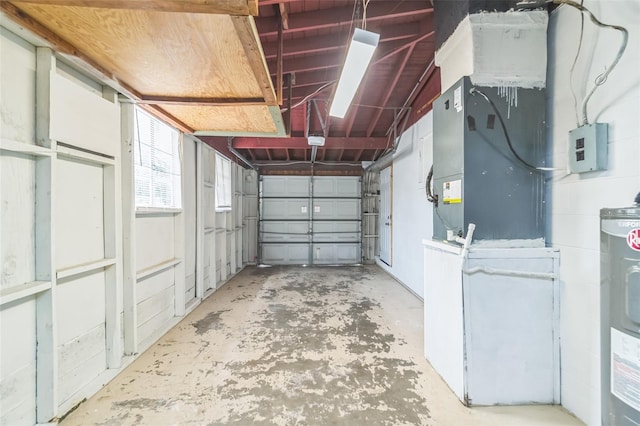 garage featuring water heater and a garage door opener