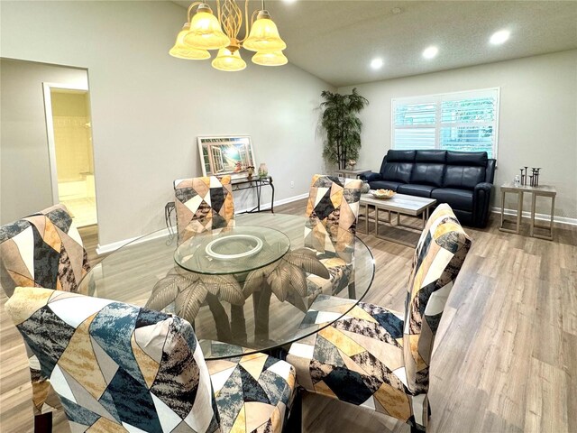 9490 SW 85th Ave Unit E, Ocala, FL 34481 - dining space with a chandelier, recessed lighting, baseboards, and wood finished floors