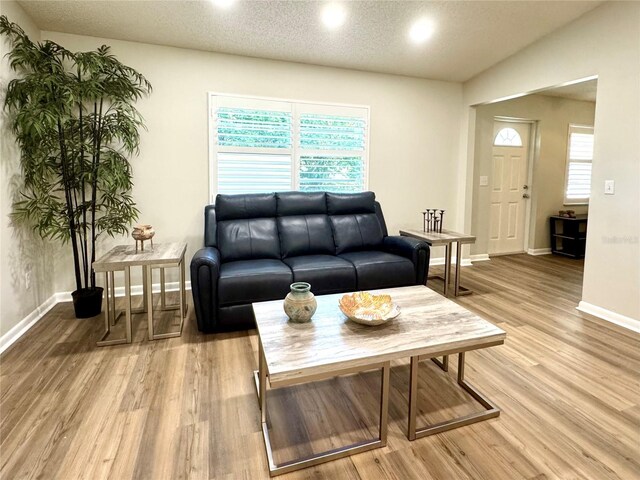 9490 SW 85th Ave Unit E, Ocala, FL 34481 - living area featuring light wood finished floors, baseboards, and recessed lighting