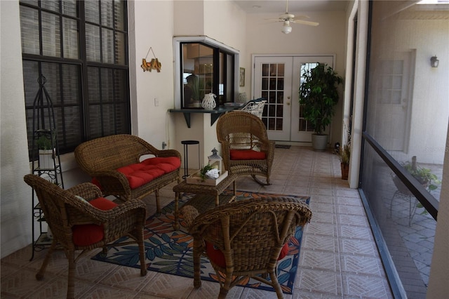 sunroom featuring plenty of natural light and french doors